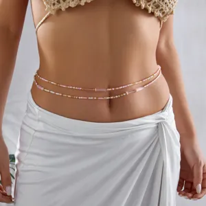 Bohemian multi-layered seed bead waist chain on model for summer beach style.