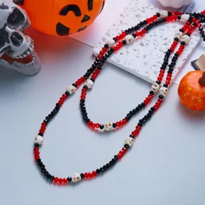 Halloween themed double-layer necklace with red and black beads and decorative skulls.