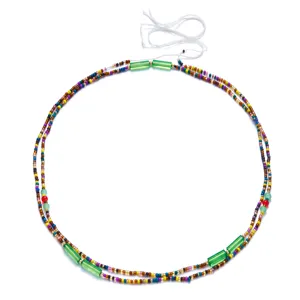 Detailed view of handmade colorful Bohemian seed bead waist chain with green glass accents