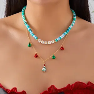 Detailed view of a Christmas double layer necklace with clay beads and tree pendant.