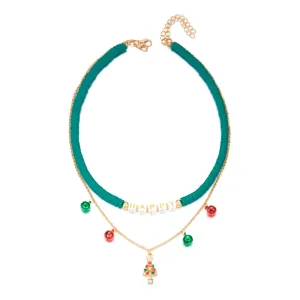 Detailed view of festive green clay bead necklace with HAPPY letter beads and charms