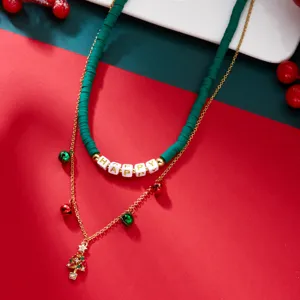 Detail of Christmas double-layer necklace with green clay beads and tree pendant