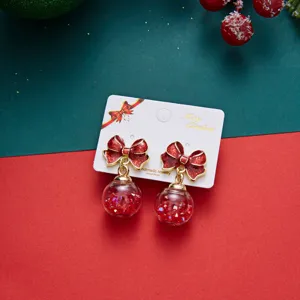 Festive red glitter bow earrings with starry clear sphere drop for Christmas holiday