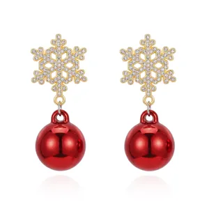 Exquisite detail of Christmas snowflake earrings featuring sparkling crystals and red spheres