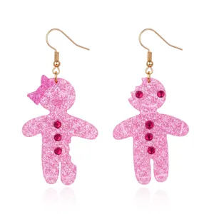 Dettaglio orecchini natalizi omino di pan di zenzero rosa glitterati con strass