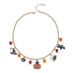 Detailed view of Halloween charm necklace featuring pumpkin, spider, and bat pendants