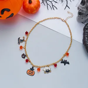 Close-up view of Halloween necklace featuring pumpkin and spider enamel charms
