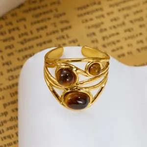 Detailed close-up of a retro gold tiger eye ring with a double-layer band design.