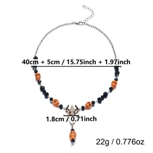 Detailed view of Halloween necklace featuring orange skull beads and a spider pendant with size