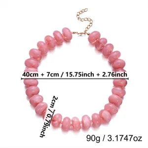 Macro view of pink resin beaded necklace with length and bead size annotations.