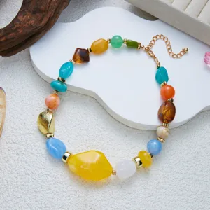 Close-up detail of vibrant necklace featuring irregular colorful mottled resin beads