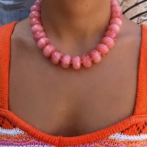 Fashionable pink resin beaded collarbone necklace with a bohemian style on model