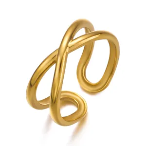 Close-up of minimalist gold-plated stainless steel double-layer crisscross ring