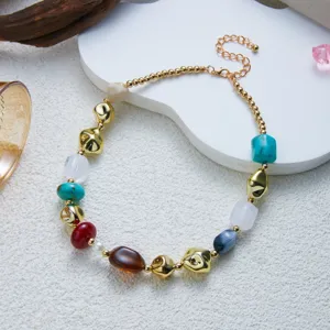 Detail view of colorful marbled resin beads and irregular gold accents on a choker