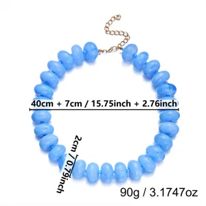 Detail view of blue resin bead necklace with measurements in cm and inches