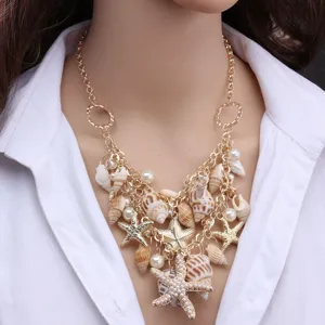 Bohemian multi-layer shell necklace with gold chain and pearls for women fashion style.
