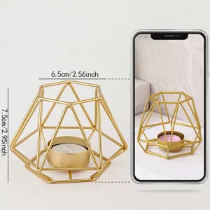 Modern geometric metal candle holder with tealight, golden home decor ornament and table centerpiece.