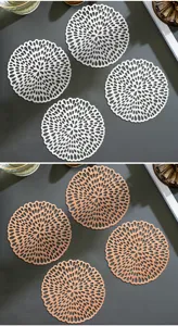 Hollow round PVC coaster detail showing intricate floral cutouts and heat insulation design.