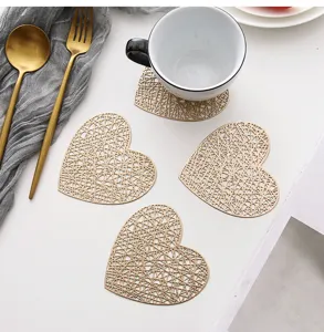 Gold hollow heart PVC coasters, heat insulated coffee cup mats, stylish kitchen table decor.