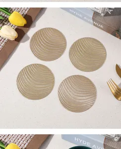 Round hollow bronzing PVC coasters set, elegant gold coffee cup mats for home table decor.