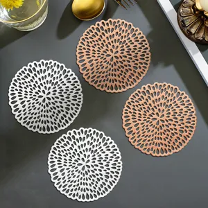 Round hollow PVC coaster, heat-resistant table mat, stylish coffee cup pad for home decor.