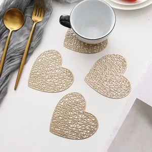 Gold hollow heart PVC coaster set, creative heat-insulation mat for coffee cup, home table decor.