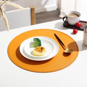 Round leather placemat detail view, waterproof and oil-proof dining table mat decoration.