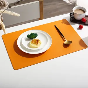 Orange leather placemat detail view showing texture, heat resistant and modern dining table decor.