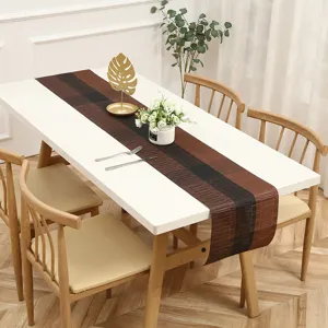 Zen style fabric table runner detail, elegant brown striped dining table decorative mat for home.