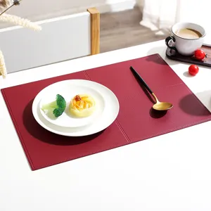 Detailed view of the elegant rectangular leather placemat with grid stitching, perfect for dining.