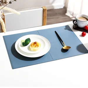 Detail shot of Nordic blue leather placemat, waterproof and heat-resistant table pad for dining.