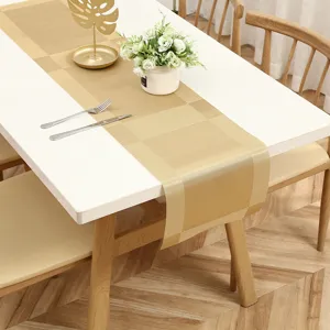 Modern gold table runner detail, elegant woven fabric for dining table decor and home styling.