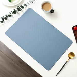 Blue faux leather placemat detail closeup, waterproof heat resistant dining table mat.