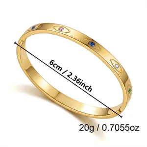 Roestvrijstalen goudkleurige armband met kleurrijke evil eye en 6 cm diameter