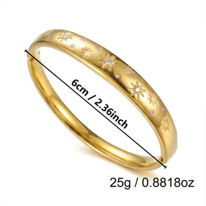 Prachtige goudkleurige roestvrijstalen armband met stergravures en ingelegde kristallen