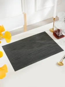 Detail view of a luxury PVC placemat, heat-resistant and waterproof for modern dining tables.