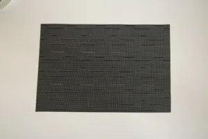 Dark grey woven PVC placemat, heat resistant and waterproof table mat for dining table.