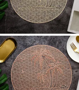 Detail view of hollow gold placemat with tropical palm tree and wave pattern for dining table.