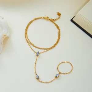 Bracelet de doigt en acier inoxydable doré avec zircons bleus en taille marquise