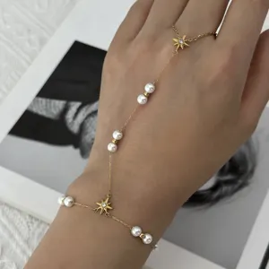 Bracelet de main en acier doré avec perles et breloques en forme d'étoile à huit branches