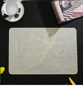 Detailed view of rectangular PVC hot-stamped gold feather patterned placemat heat insulation pad.