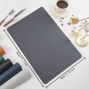 Detailed view of the dark grey woven PU leather placemat, waterproof, heat-insulating table mat.