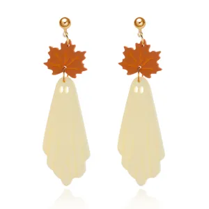 Elegant Halloween ghost drop earrings with orange maple leaf design on white background