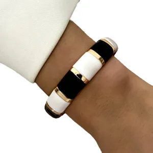 Fashionable retro black and white enamel bangle bracelet with elegant gold trim accents