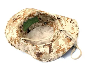 Detail of desert digital camo boonie hat interior, showing breathable vents and chin strap.