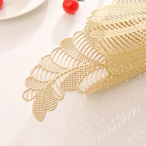 Hollow gold PVC placemat detail, leaf pattern table runner, heat resistant dining decor.