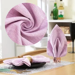 Purple linen cloth napkin detail showcasing high quality fabric texture and table decor.