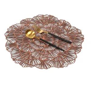 Hollow out PVC placemat in rose gold with elegant ginkgo leaf pattern, heat resistant table mat.