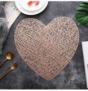 Nordic hollow heart placemat detail, rose gold PVC heat insulation table mat for dining decor.