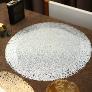 Silver round woven placemat with delicate fringe trim, heat-resistant table mat for dining